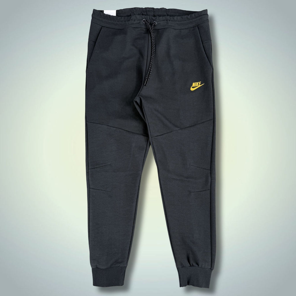 Nike Tech Fleece férfi sportos nadrág, grafitszürke, sárga logóval. Prémium minőség